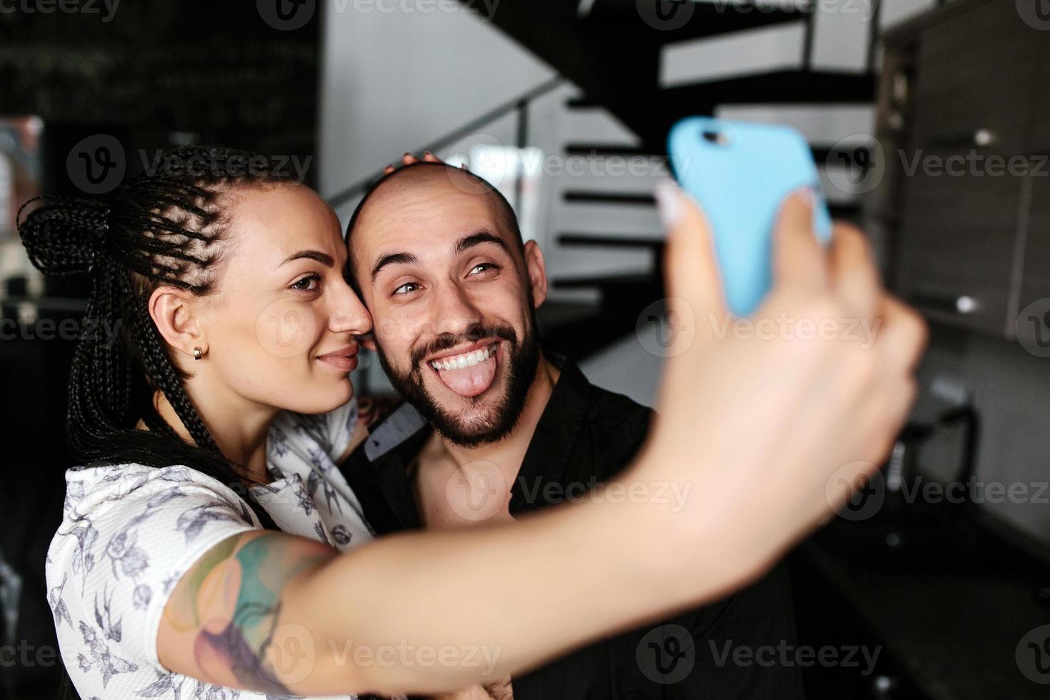 man and woman making selfie photo