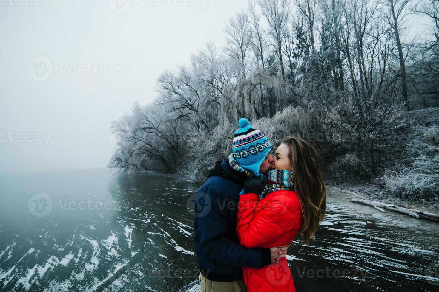 beautiful couple having fun on the pier photo