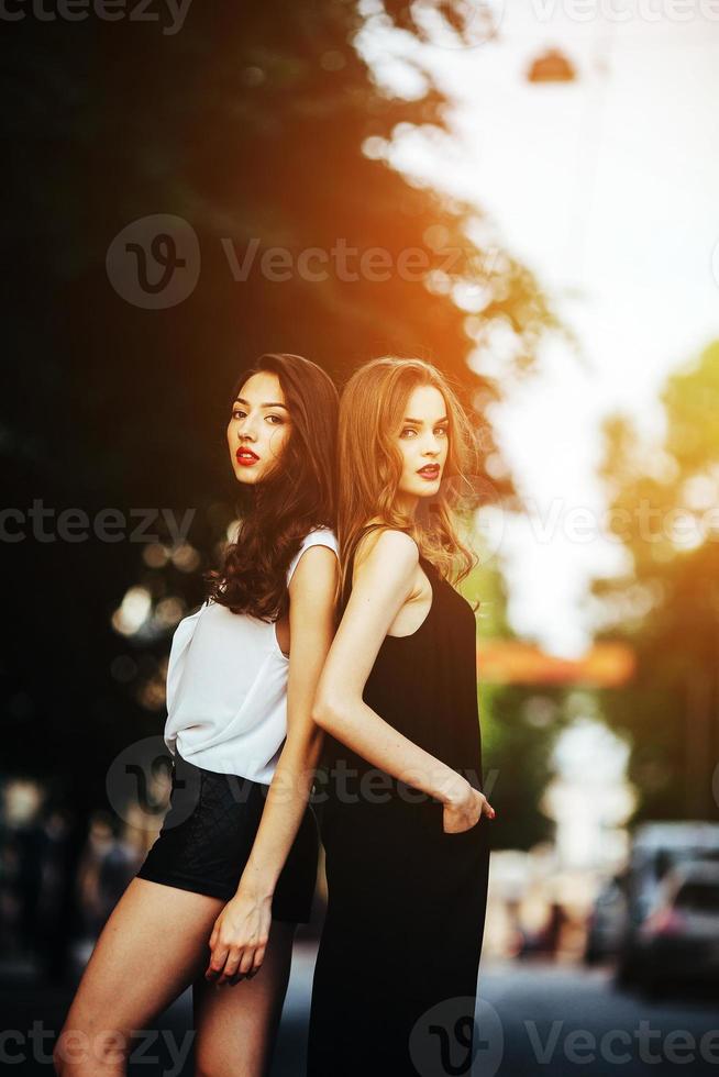 pretty girls posing in a city street photo