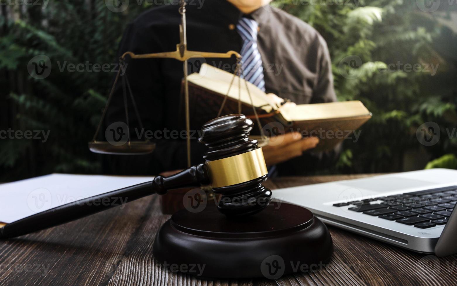 Business and lawyers discussing contract papers with brass scale on desk in office. Law, legal services, advice, justice and law concept picture with film grain effect photo