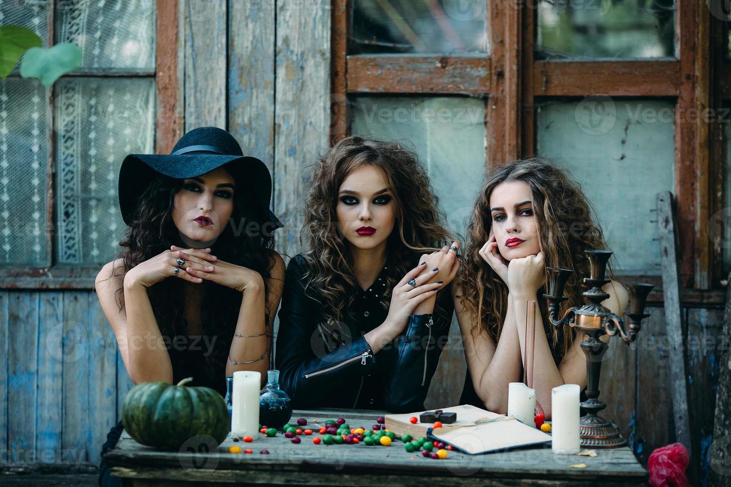 three witches at the table photo