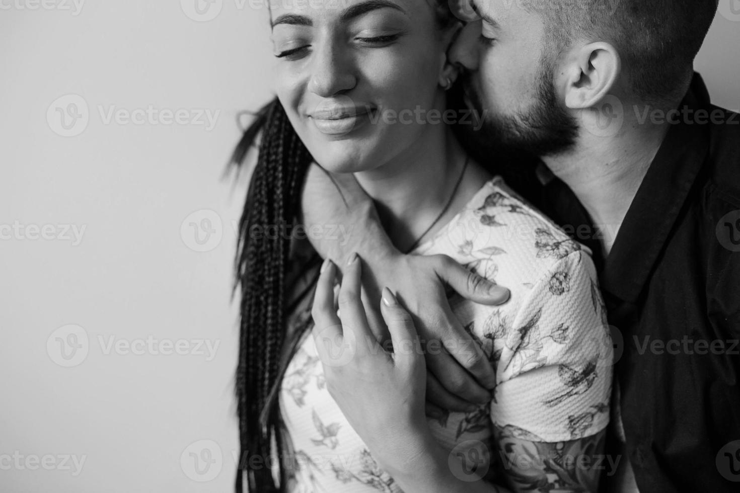 man and woman on a white wall photo