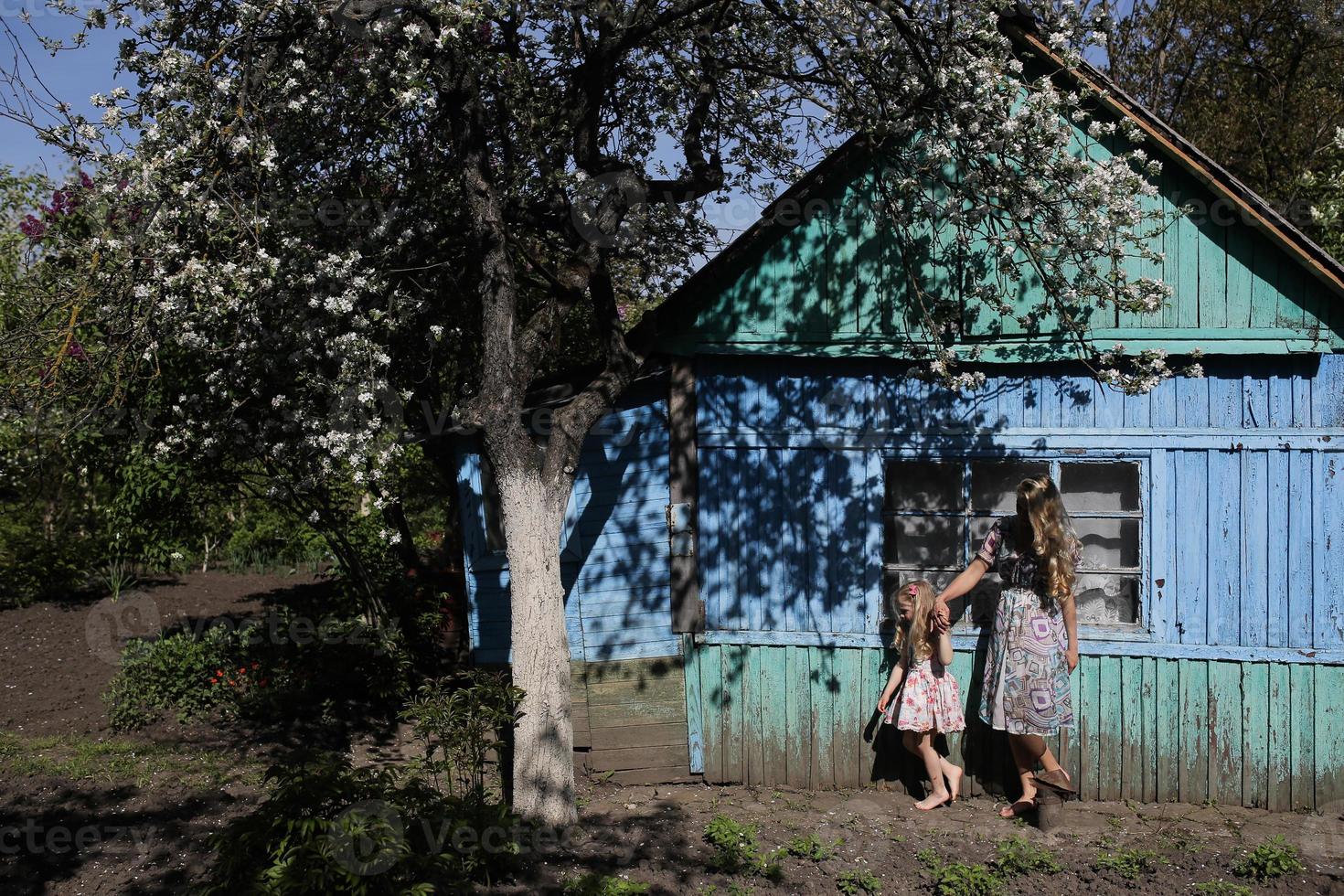 mother and daughter in the garden photo