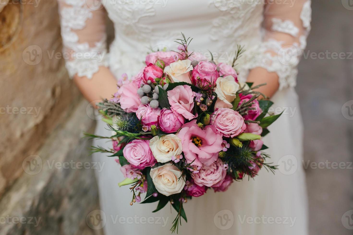 Bride with bouquet, closeup photo