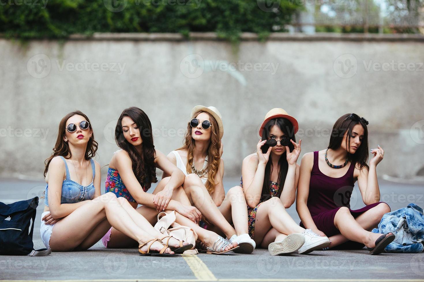 Five beautiful young girls relaxing photo
