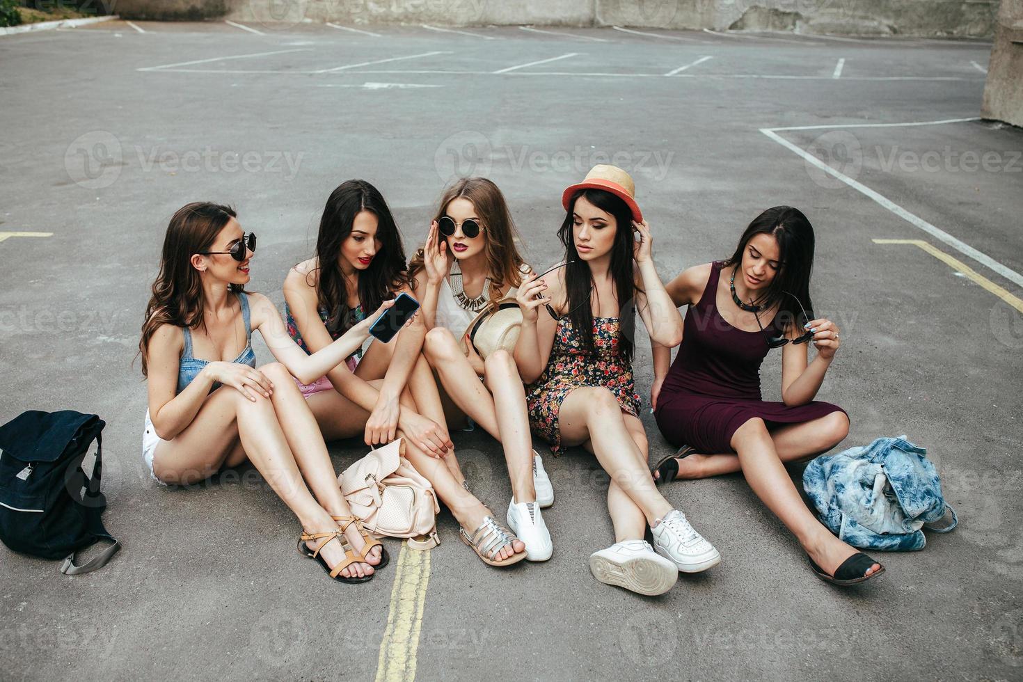 Five beautiful young girls relaxing photo