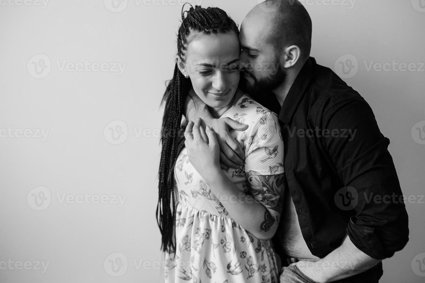 man and woman on a white wall photo