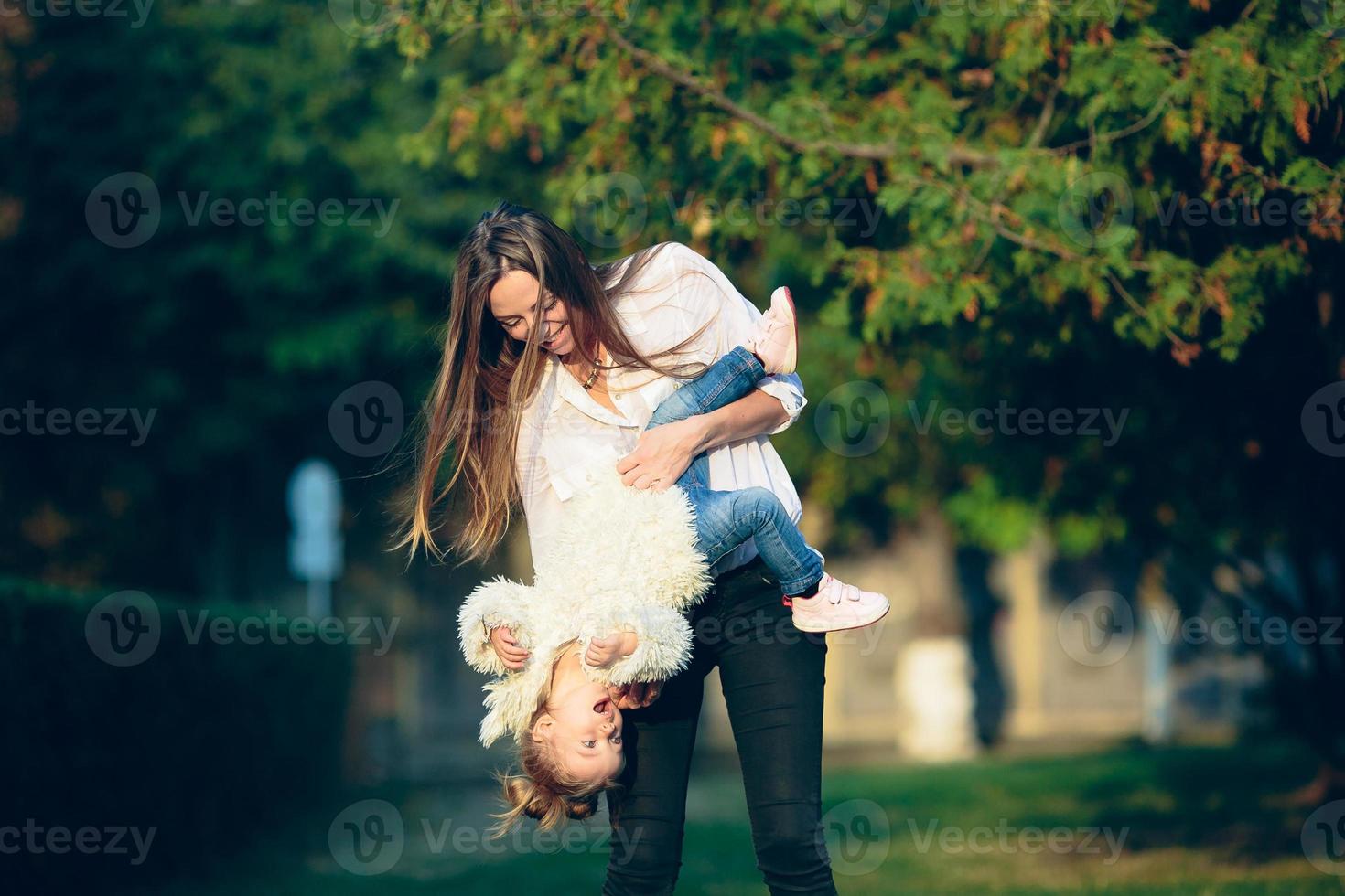 Mother and little daughter in a park photo