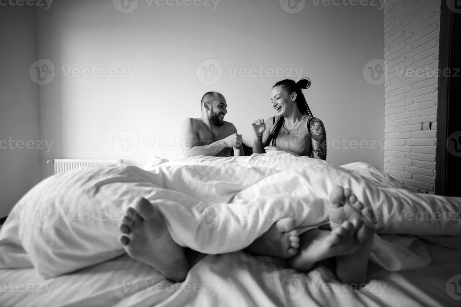 man and woman on the bed photo