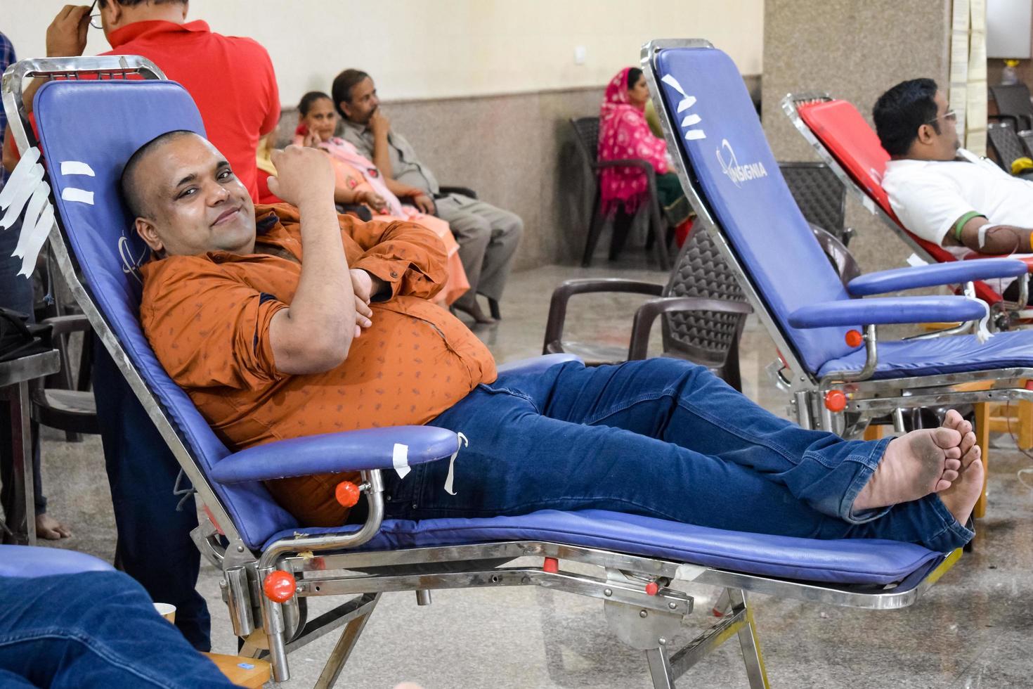 Delhi, India, June 19 2022 - Blood donor at Blood donation camp held at Balaji Temple, Vivek Vihar, Delhi, India, Image for World blood donor day on June 14 every year, Blood Donation Camp at Temple photo