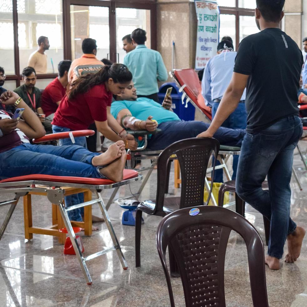 Delhi, India, June 19 2022 - Blood donor at Blood donation camp held at Balaji Temple, Vivek Vihar, Delhi, India, Image for World blood donor day on June 14 every year, Blood Donation Camp at Temple photo