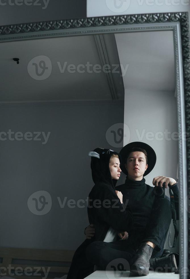 man and woman in black clothes photo