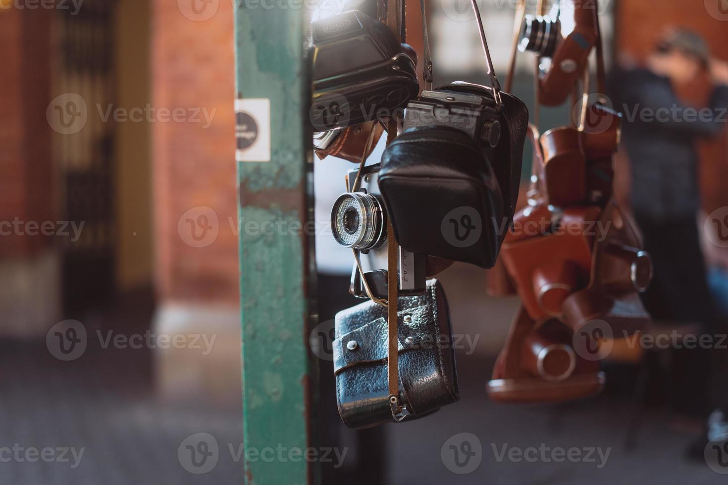 Old cameras are sold at a street market photo