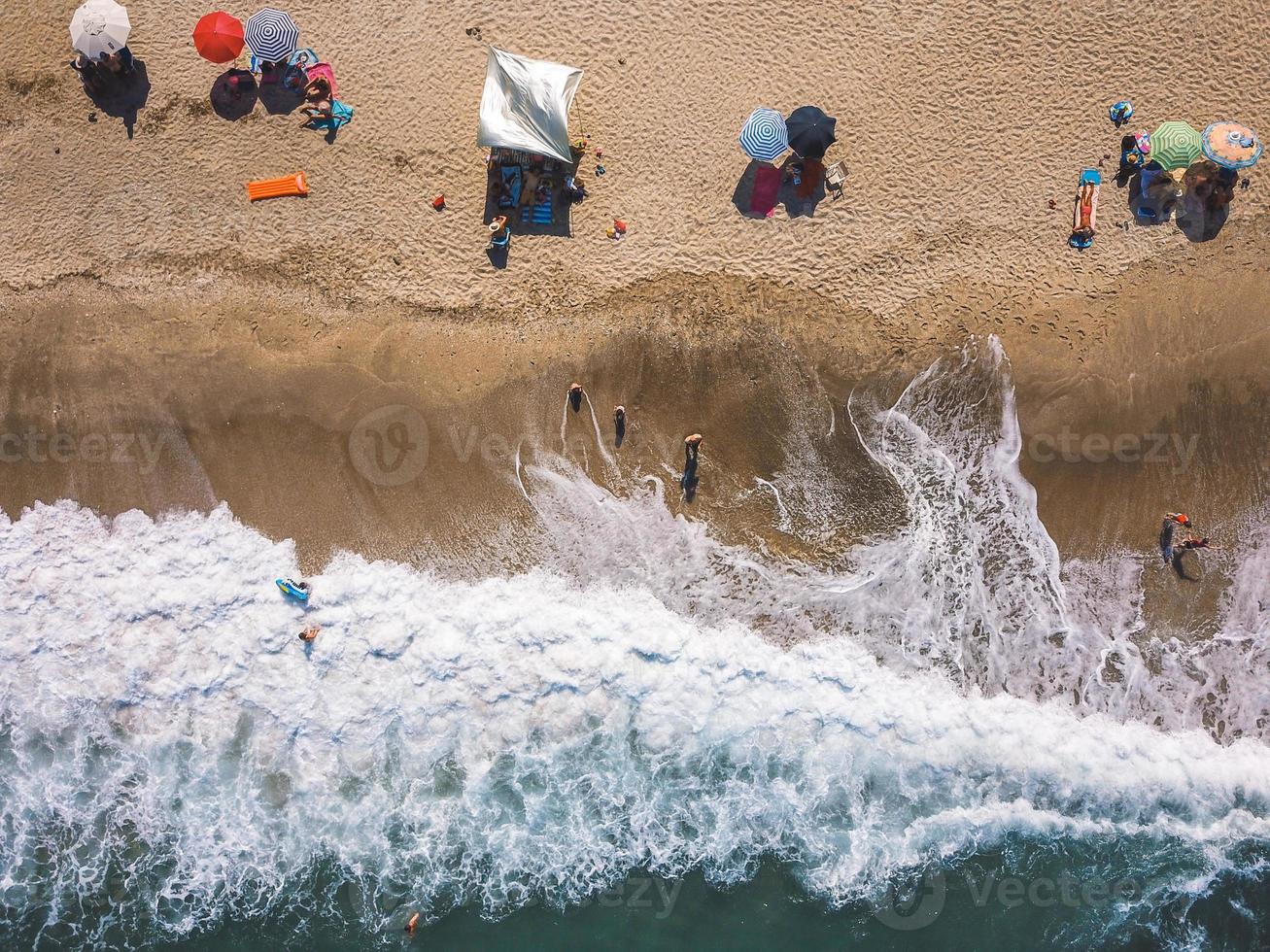 Beach with sun loungers on the coast of the ocean photo