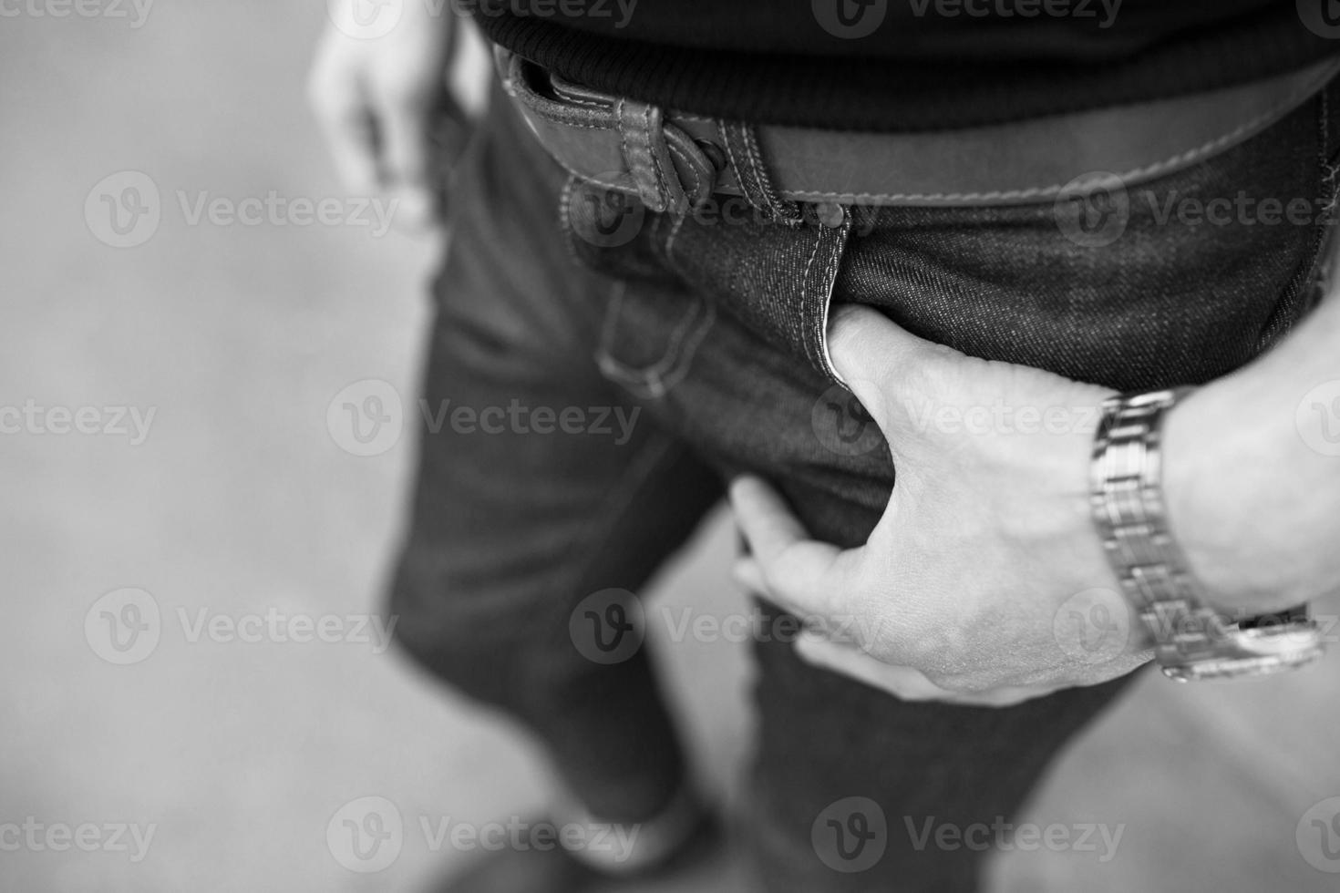 A man dressed in jeans, a close-up shot photo