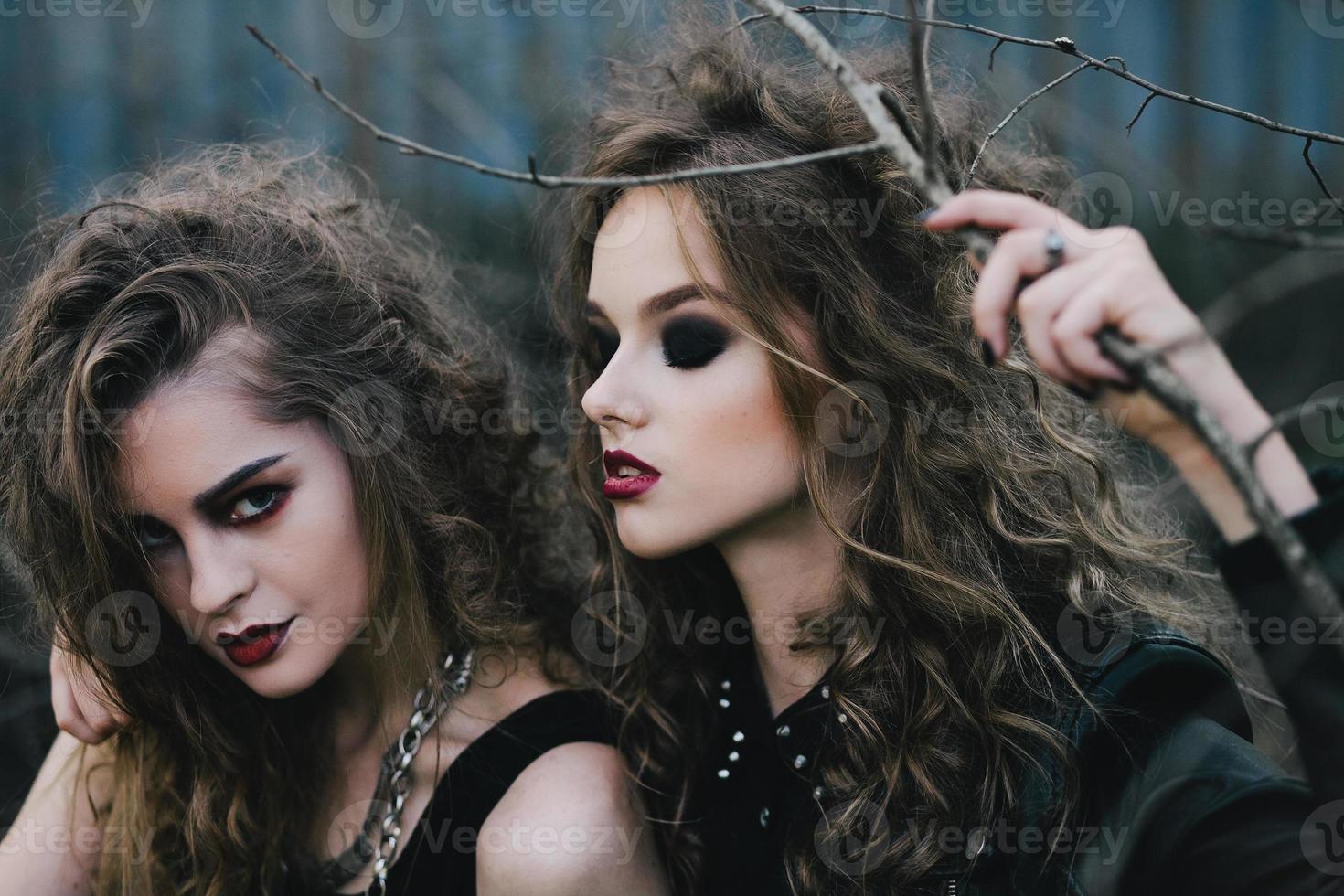 Two vintage witches gathered eve of Halloween photo