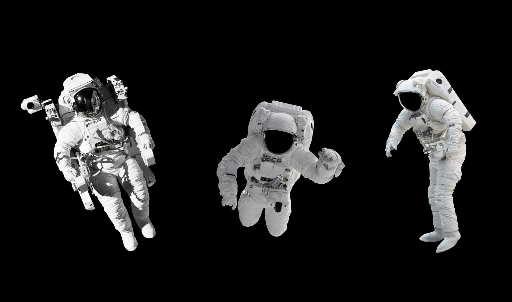 Space suits isolated on black background with clipping path. Elements of this image furnished by NASA. photo