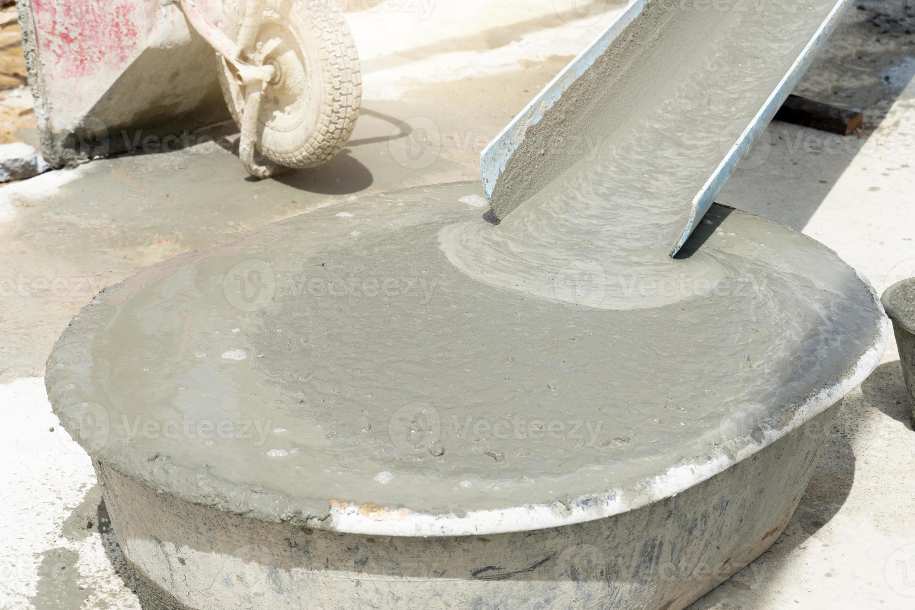 Liquid cement water in the mortar mixing tank. flowing down from the