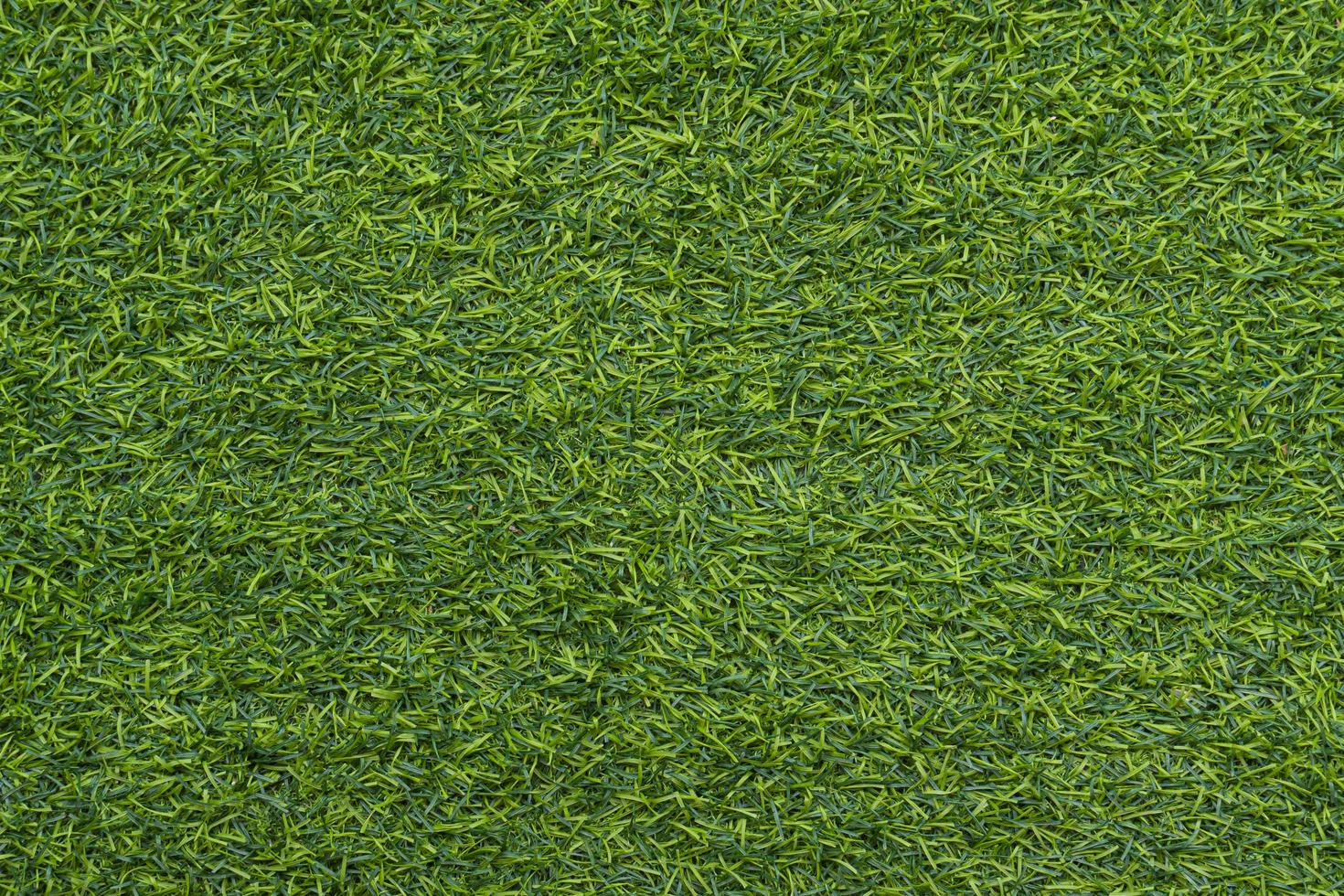 Top view of green artificial grass. For background and textured. photo