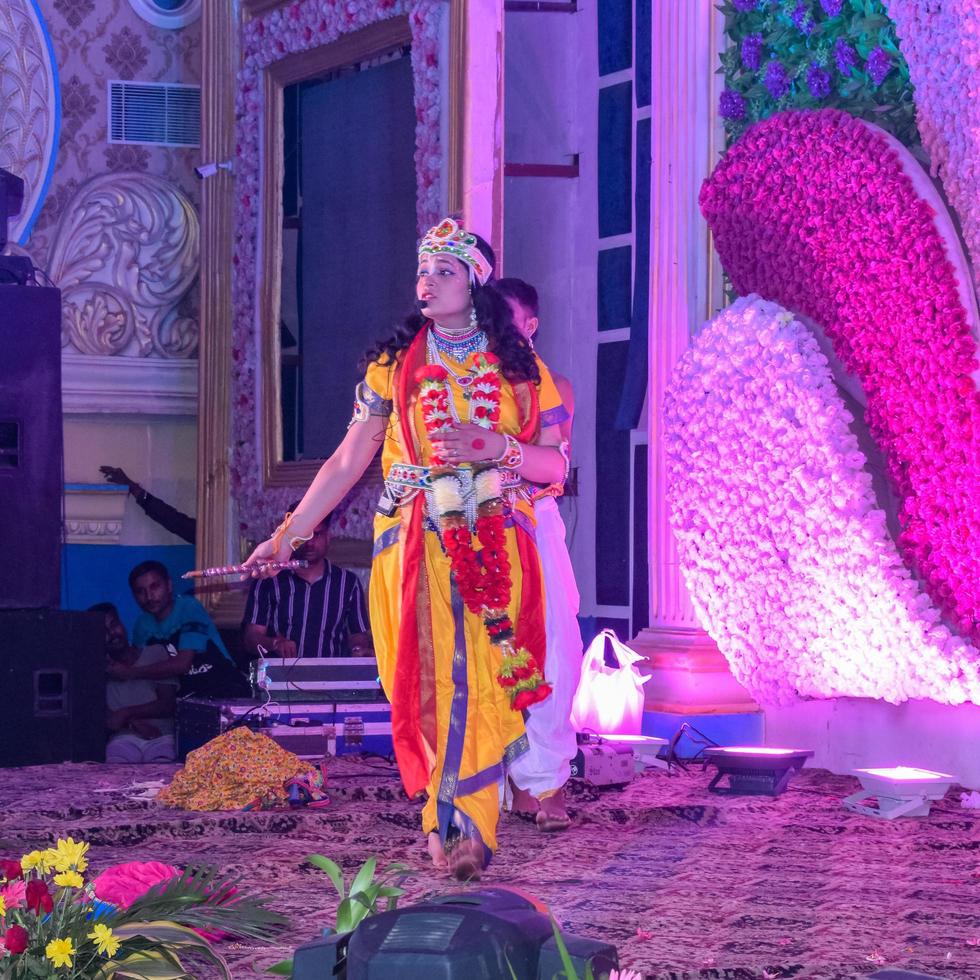 New Delhi, India - August 13, 2022 - Cute Indian dressed up as Lord Krishna and Radha on the occasion of Krishna Janmastami Festival in Delhi India, Radha Krishna performance on Janmashtami festival photo
