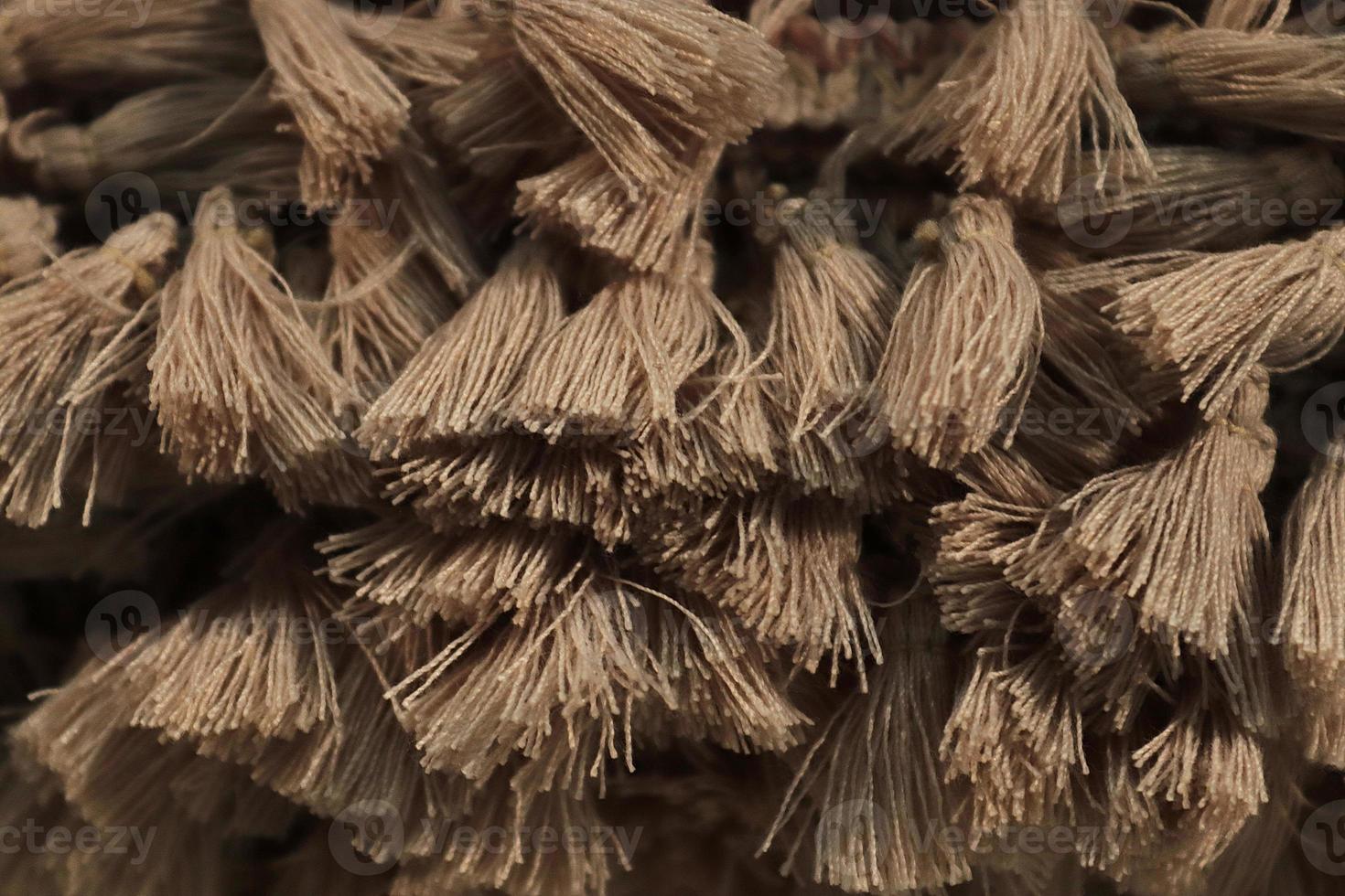 Detailed close up view on samples of cloth and fabrics in different colors found at a fabrics market photo