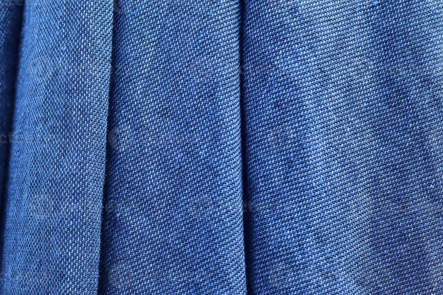Detailed close up view on samples of cloth and fabrics in different colors found at a fabrics market photo