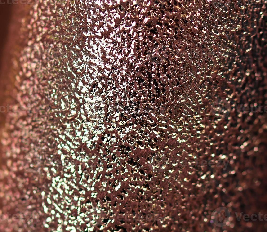 Detailed close up view on samples of cloth and fabrics in different colors found at a fabrics market photo