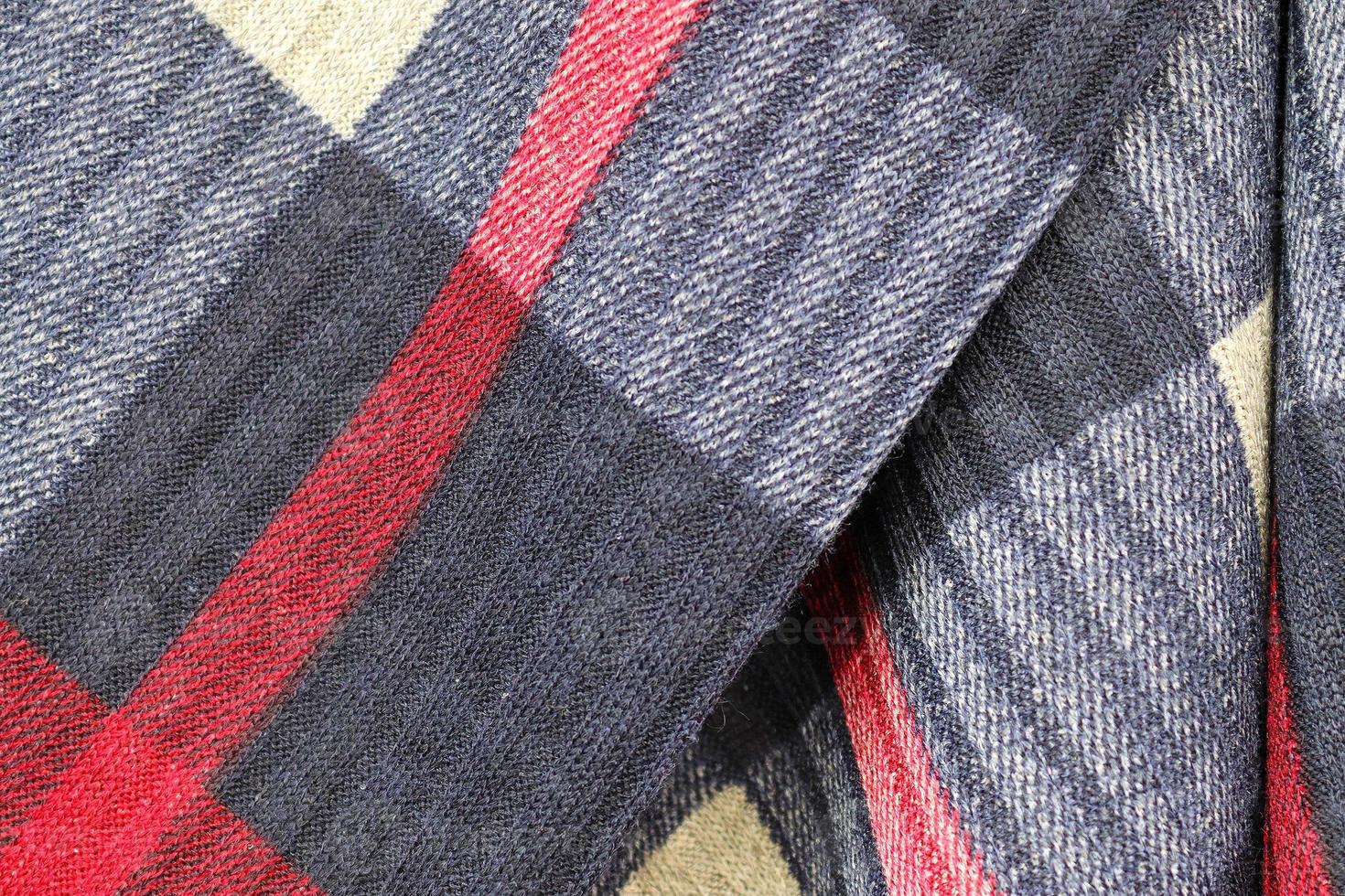 Detailed close up view on samples of cloth and fabrics in different colors found at a fabrics market photo