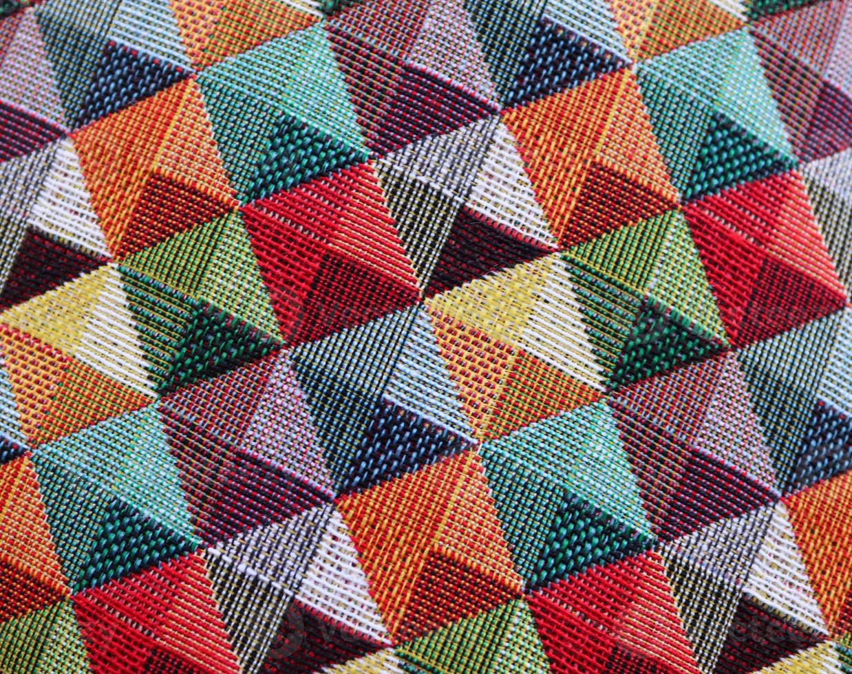 Detailed close up view on samples of cloth and fabrics in different colors found at a fabrics market photo
