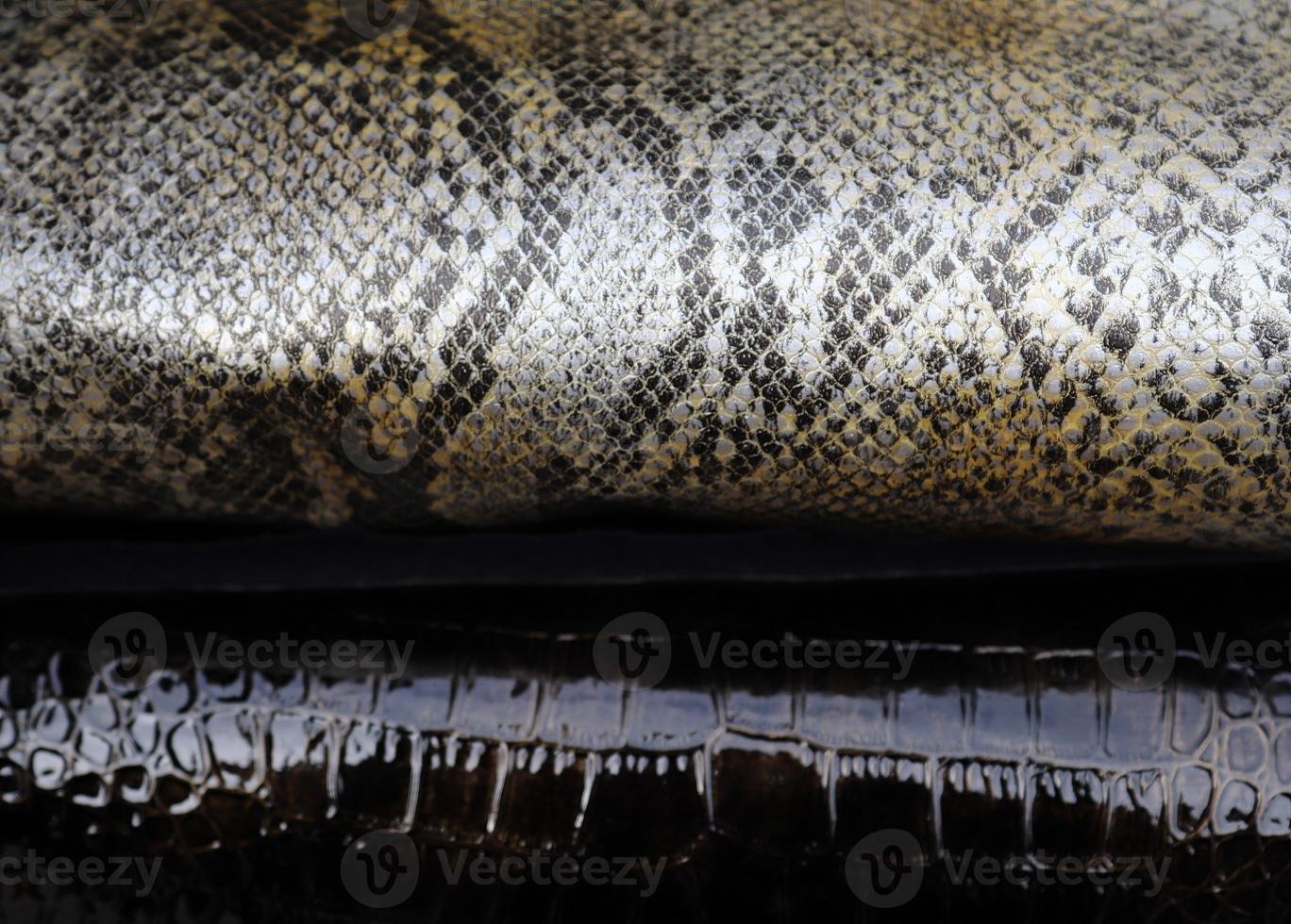Detailed close up view on samples of cloth and fabrics in different colors found at a fabrics market photo