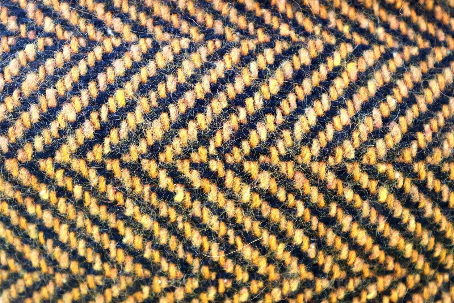 Detailed close up view on samples of cloth and fabrics in different colors found at a fabrics market photo