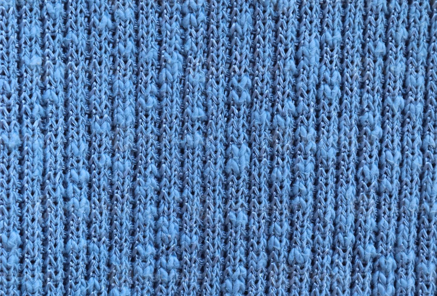 Detailed close up view on samples of cloth and fabrics in different colors found at a fabrics market photo