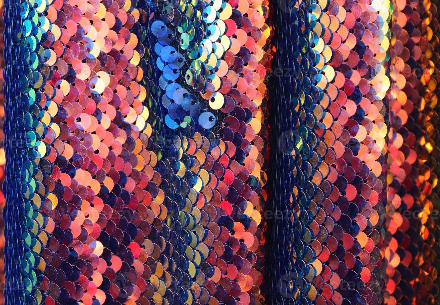 Detailed close up view on samples of cloth and fabrics in different colors found at a fabrics market photo