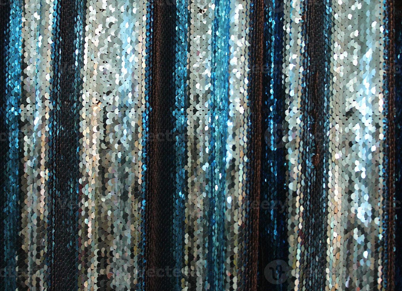 Detailed close up view on samples of cloth and fabrics in different colors found at a fabrics market photo