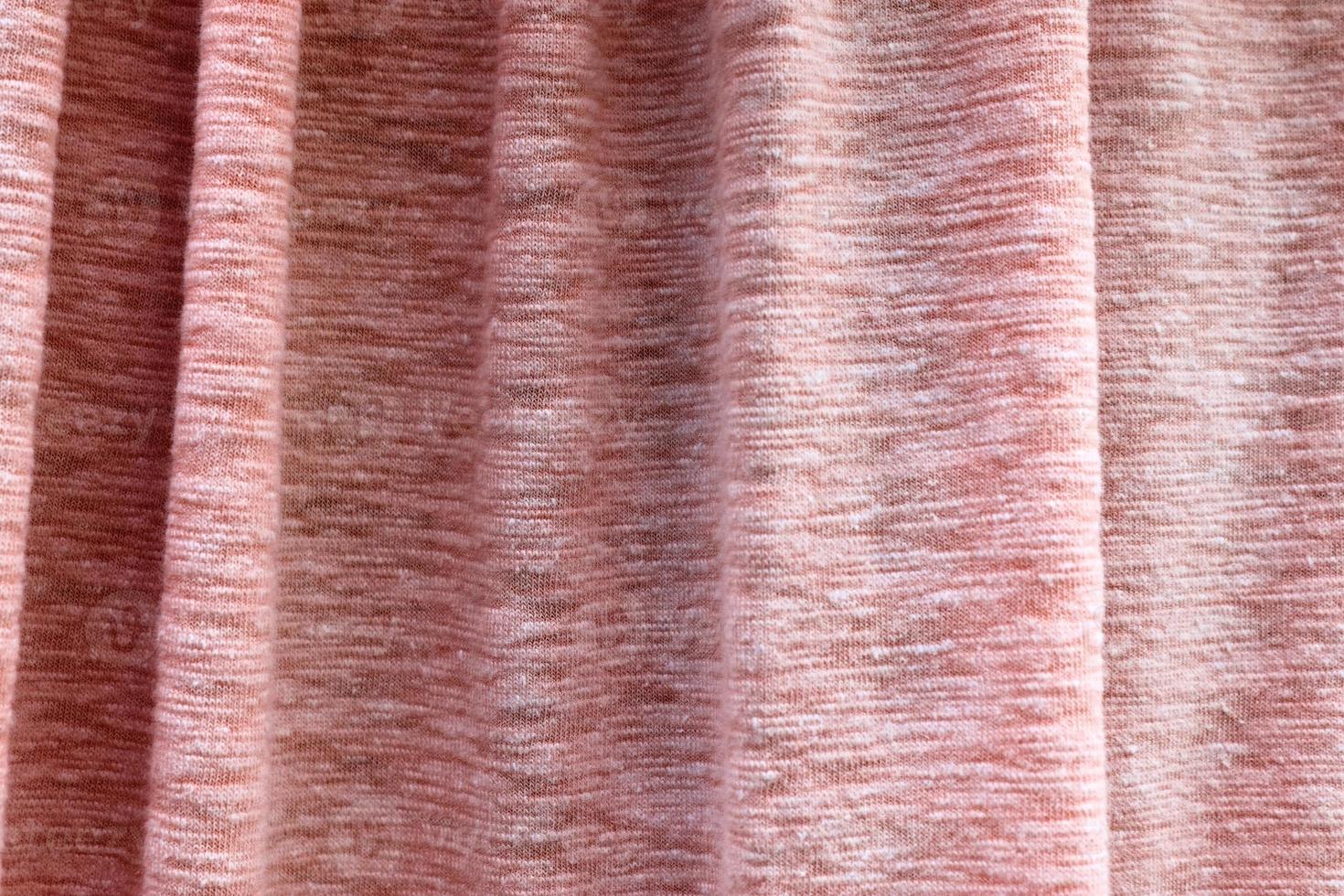 Detailed close up view on samples of cloth and fabrics in different colors found at a fabrics market photo