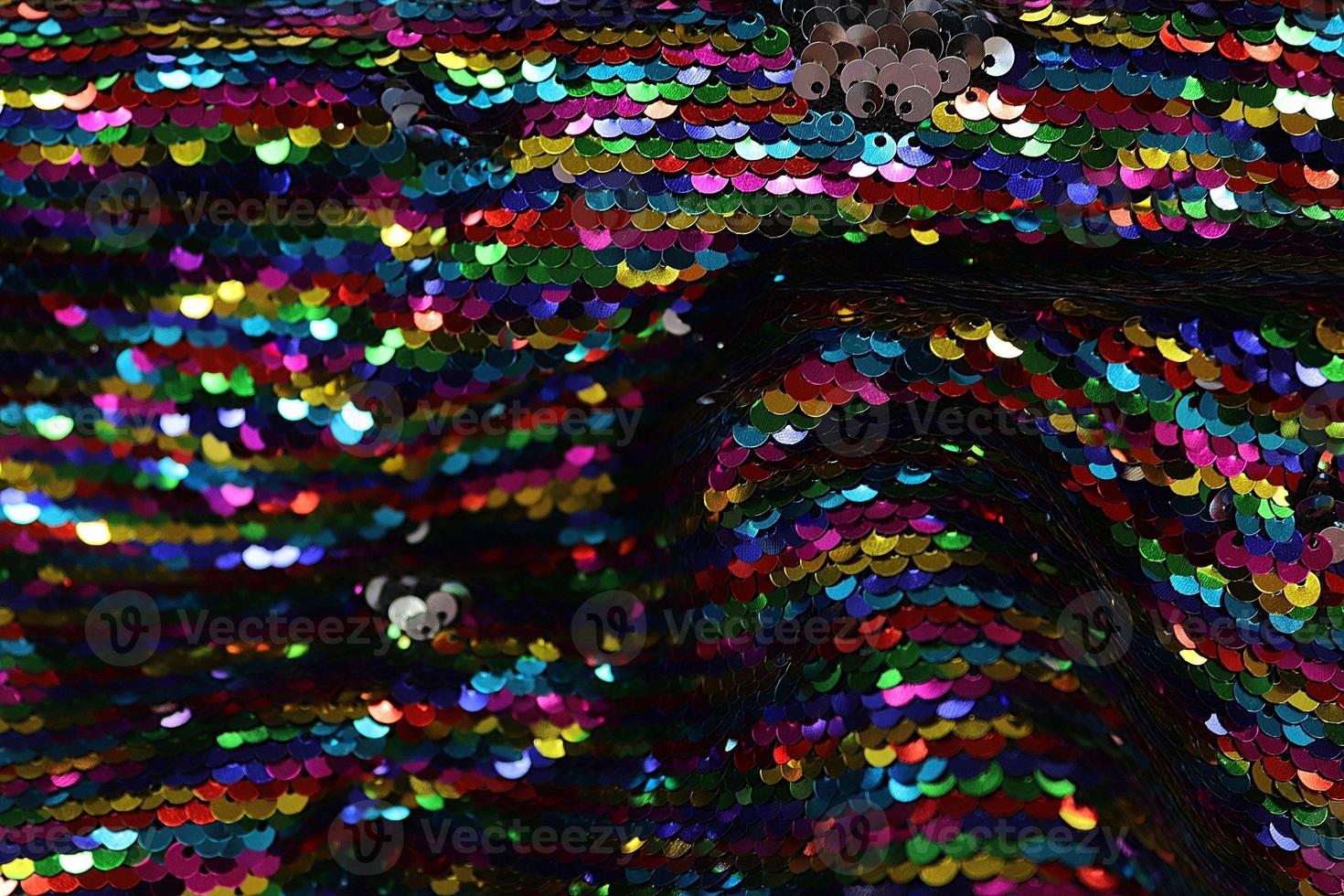 Detailed close up view on samples of cloth and fabrics in different colors found at a fabrics market photo