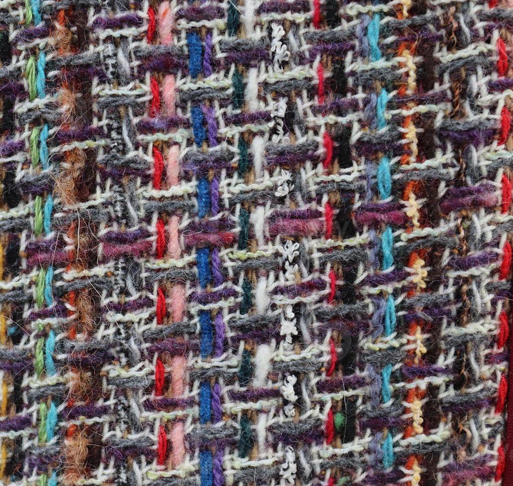 Detailed close up view on samples of cloth and fabrics in different colors found at a fabrics market photo