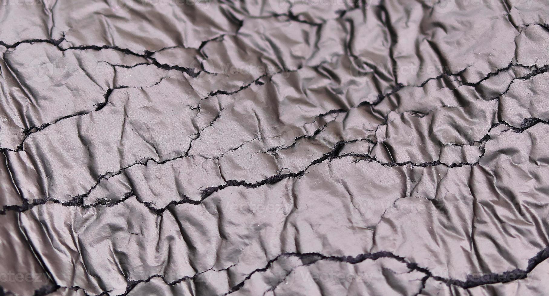 Detailed close up view on samples of cloth and fabrics in different colors found at a fabrics market photo