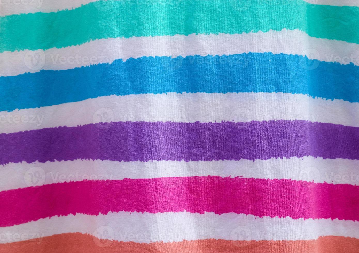 Detailed close up view on samples of cloth and fabrics in different colors found at a fabrics market photo