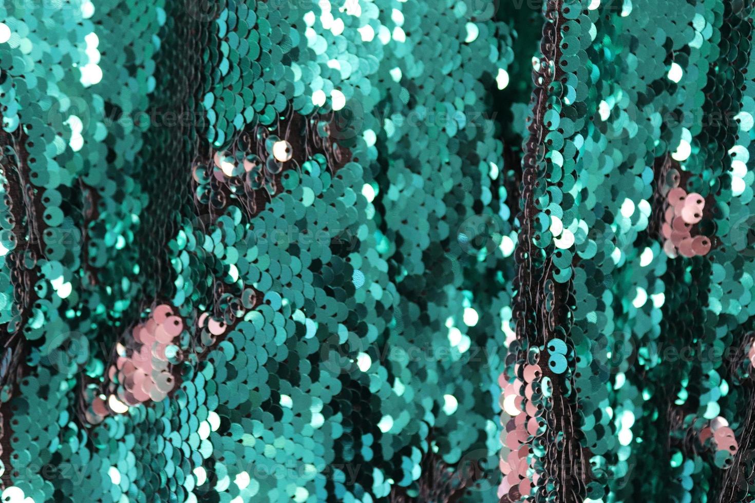 Detailed close up view on samples of cloth and fabrics in different colors found at a fabrics market photo