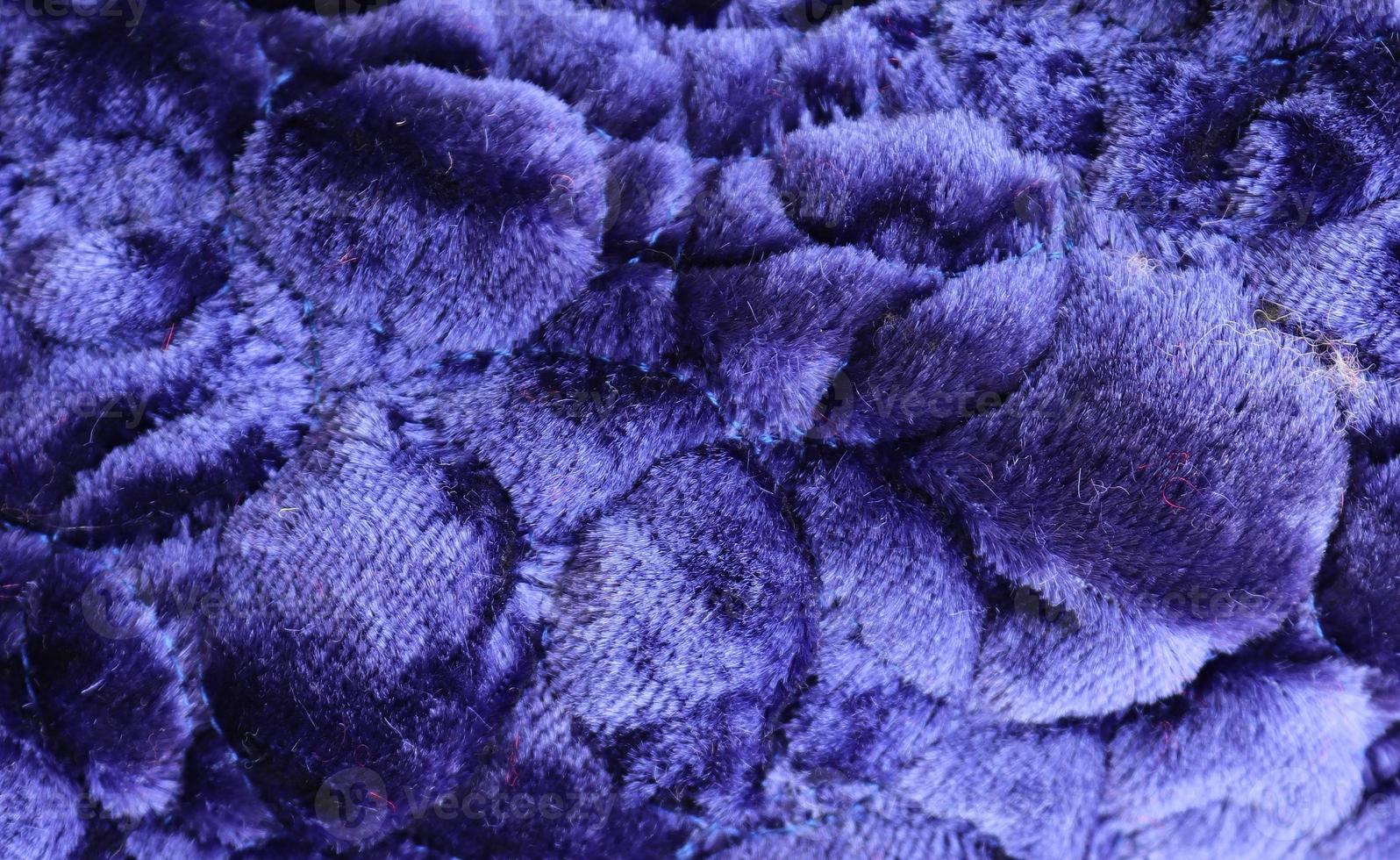 Detailed close up view on samples of cloth and fabrics in different colors found at a fabrics market photo