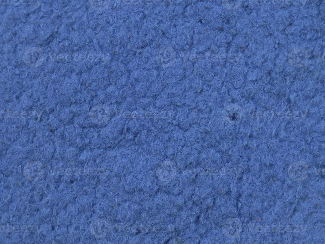 Detailed close up view on samples of cloth and fabrics in different colors found at a fabrics market photo