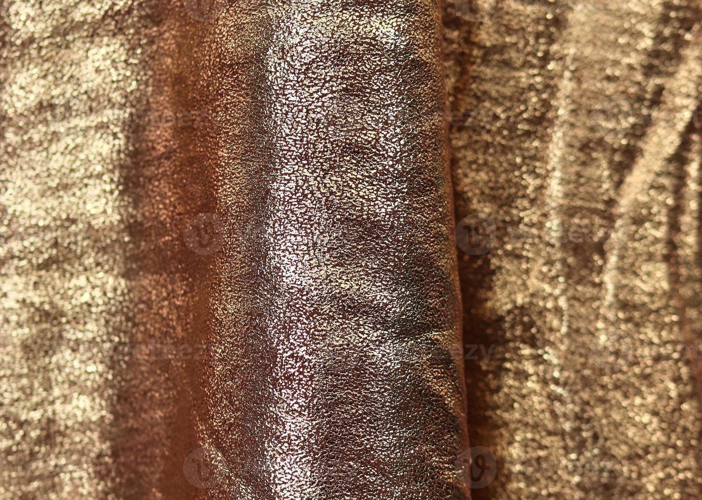 Detailed close up view on samples of cloth and fabrics in different colors found at a fabrics market photo