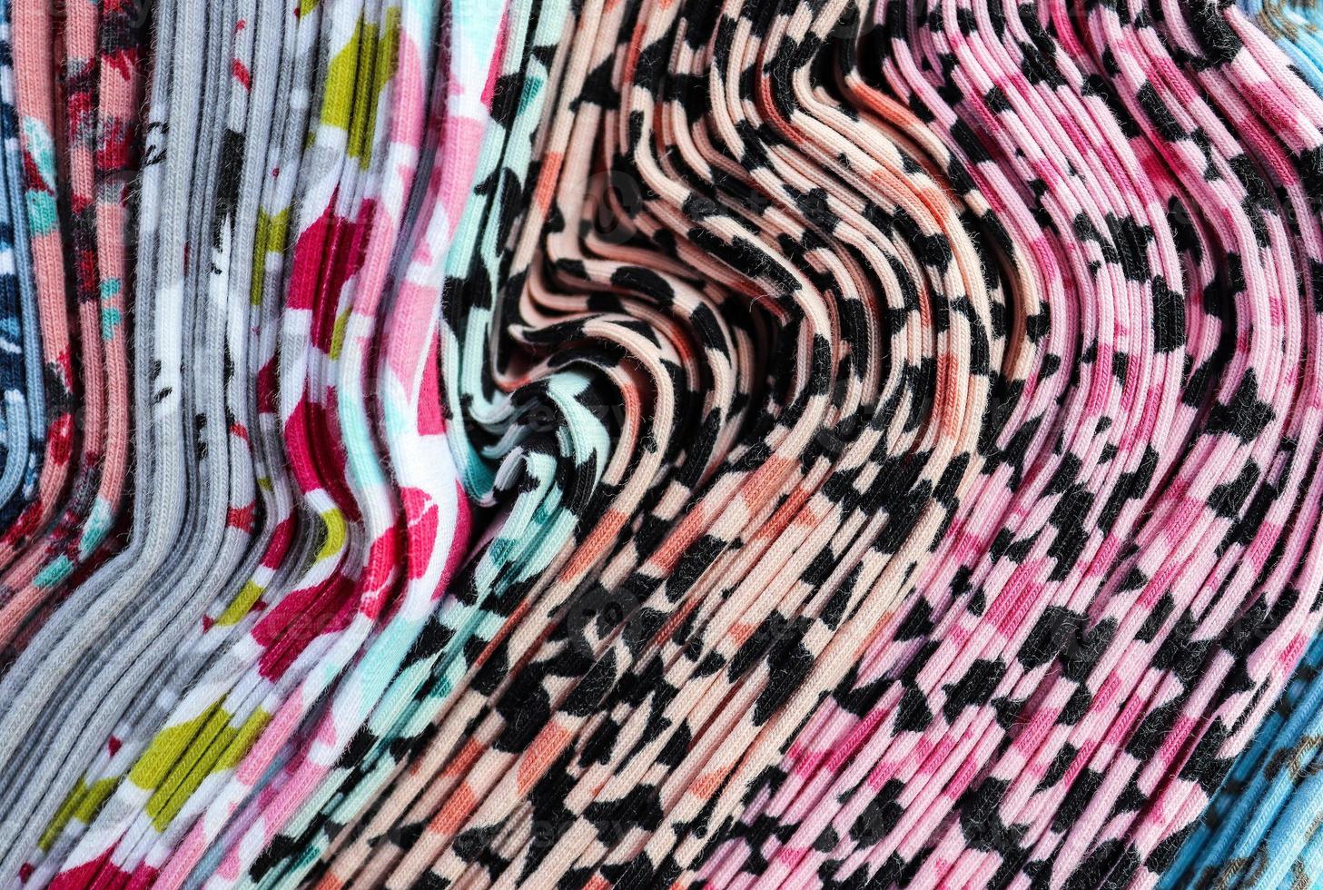 Detailed close up view on samples of cloth and fabrics in different colors found at a fabrics market photo