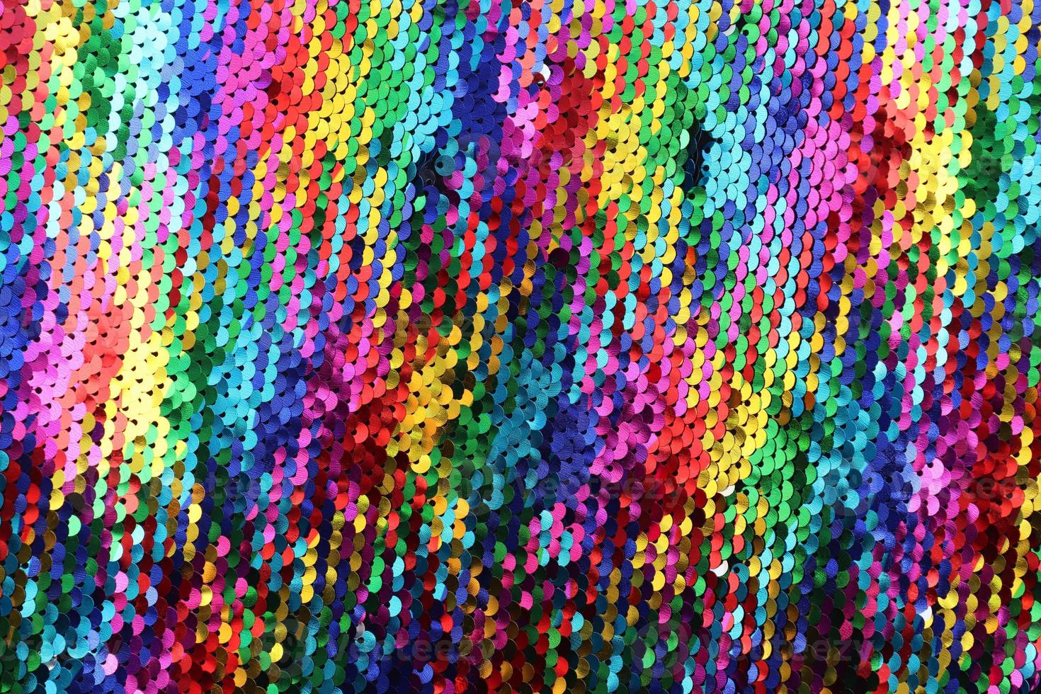 Detailed close up view on samples of cloth and fabrics in different colors found at a fabrics market photo