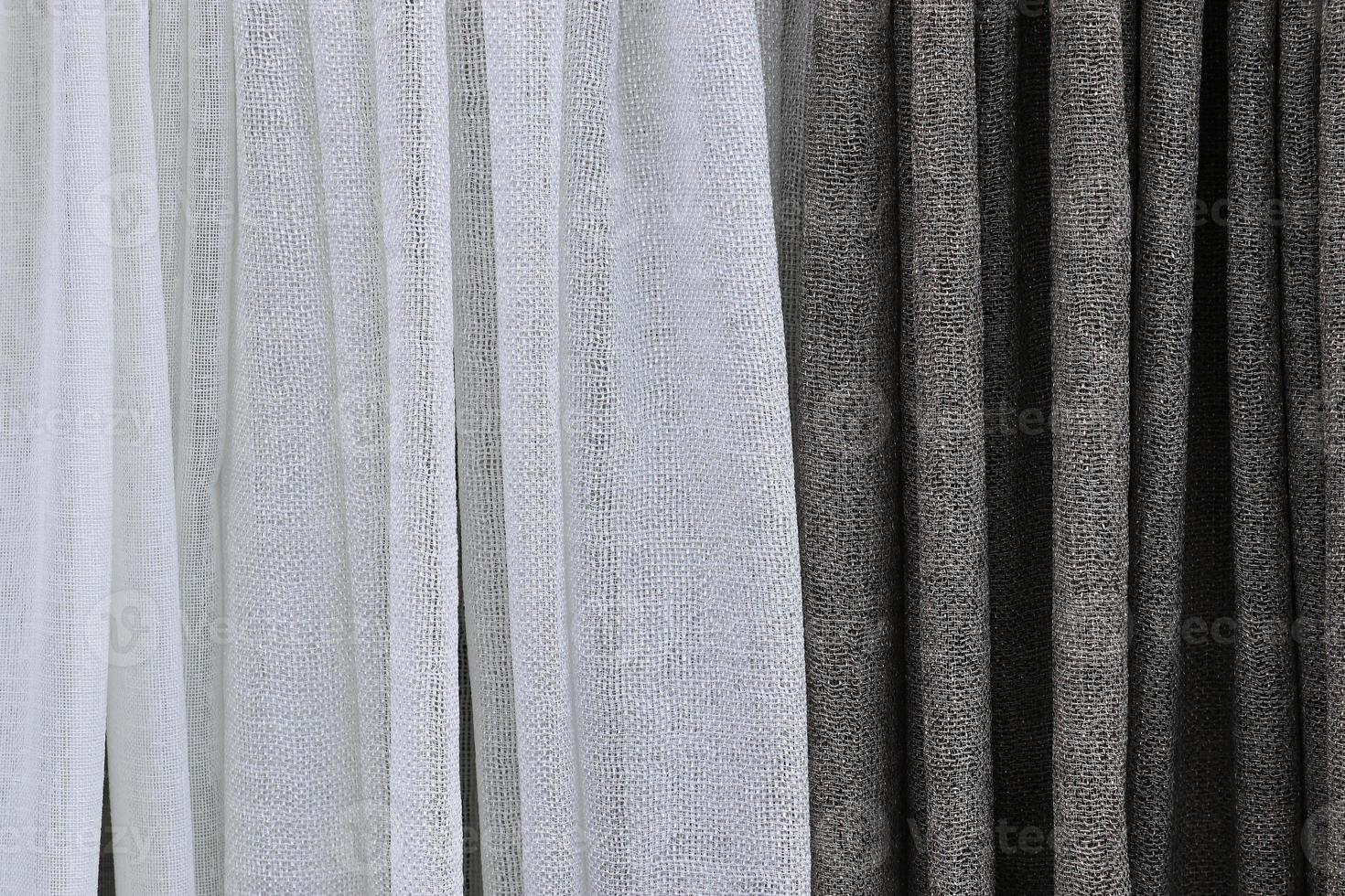 Detailed close up view on samples of cloth and fabrics in different colors found at a fabrics market photo