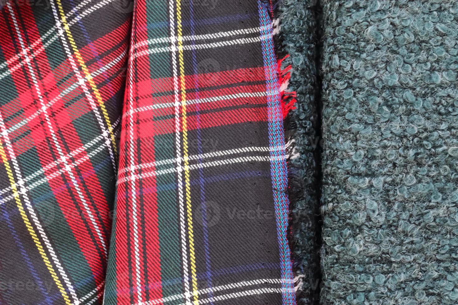 Detailed close up view on samples of cloth and fabrics in different colors found at a fabrics market photo