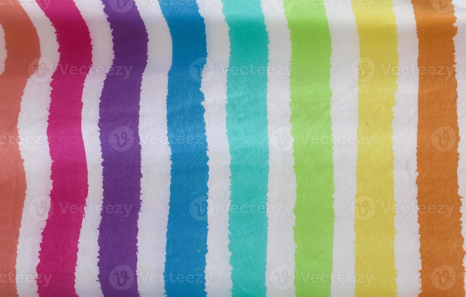 Detailed close up view on samples of cloth and fabrics in different colors found at a fabrics market photo