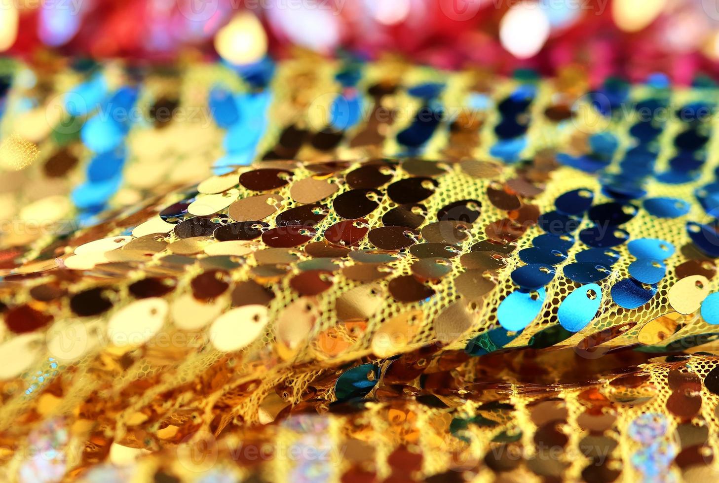 Detailed close up view on samples of cloth and fabrics in different colors found at a fabrics market photo