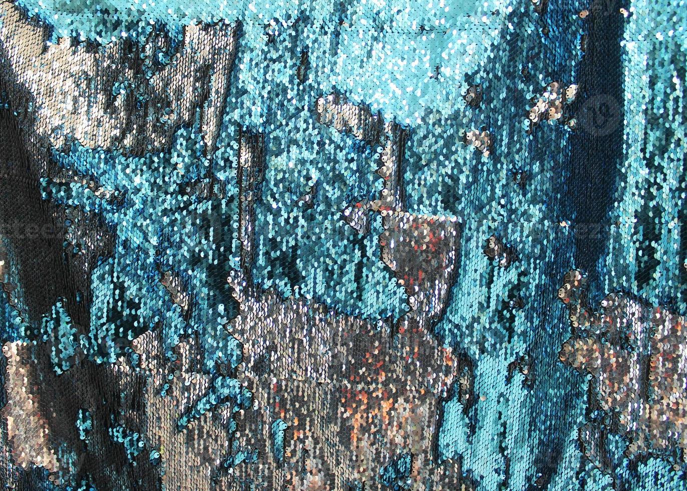 Detailed close up view on samples of cloth and fabrics in different colors found at a fabrics market photo